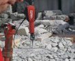 Air pumped jack hammers demolishing team